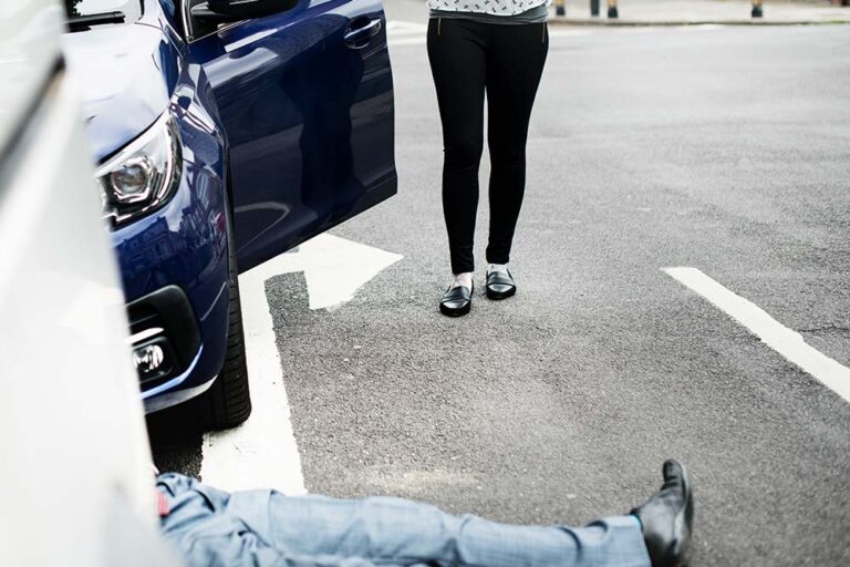 Tort law - image of person having been hit by a car, lying on the floor